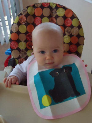 Maya loves to eat breakfast in her new bib!